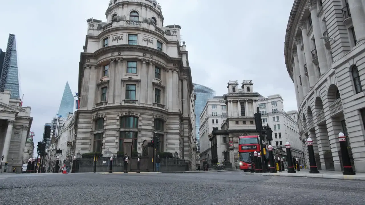 red London double decker buses passing through Bank junction city