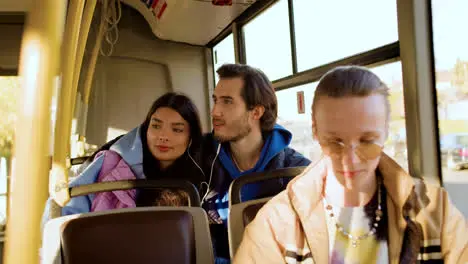 Young man listening music in the bus