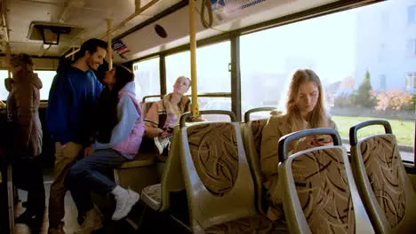 Young woman using smartphone in the bus