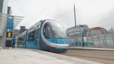 Tram Arriving At Station Stop Platform In Birmingham UK 2