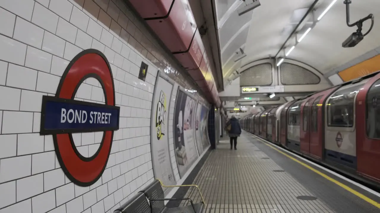 Quiet Bond street roundel London underground central line tube leaving station