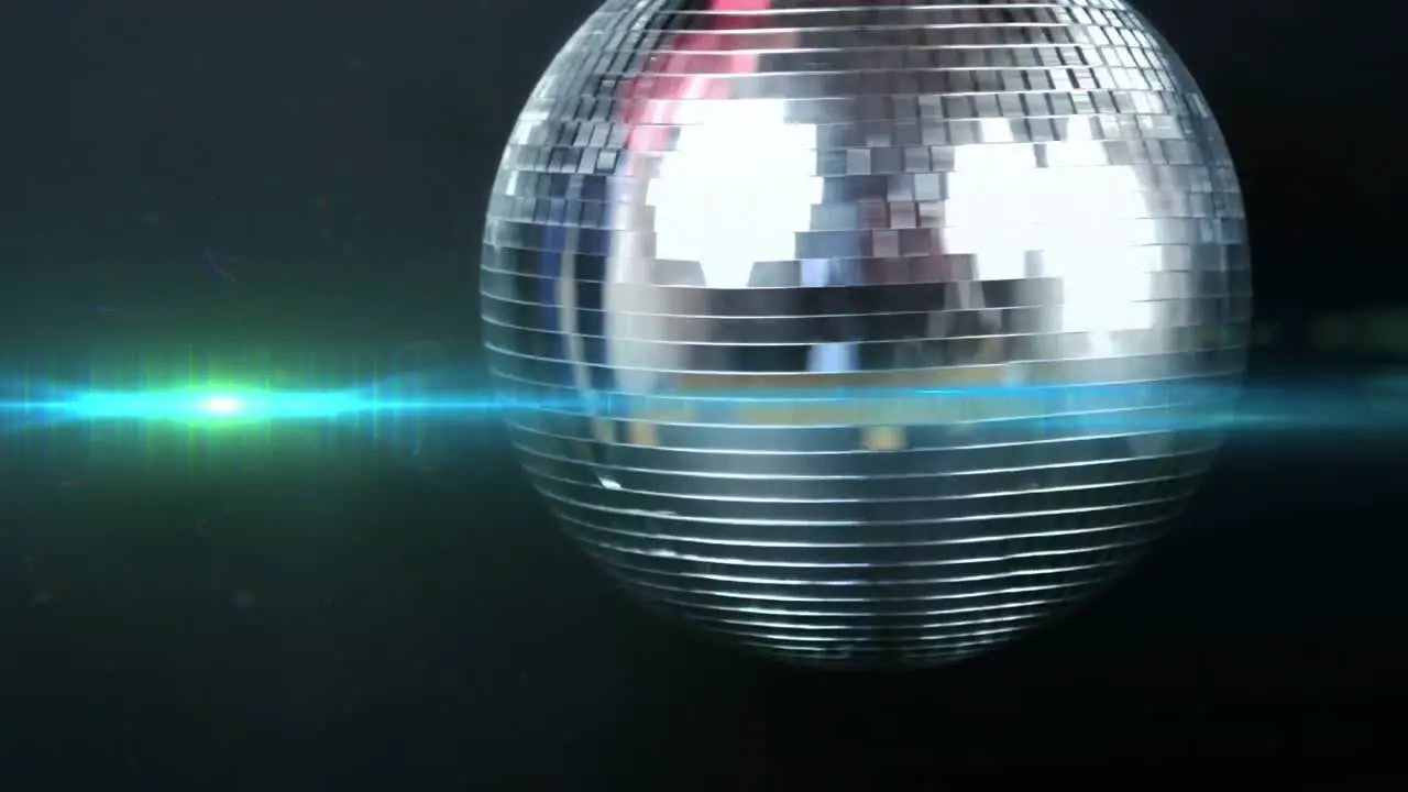 Animation of mirror disco ball spinning and moving blue light