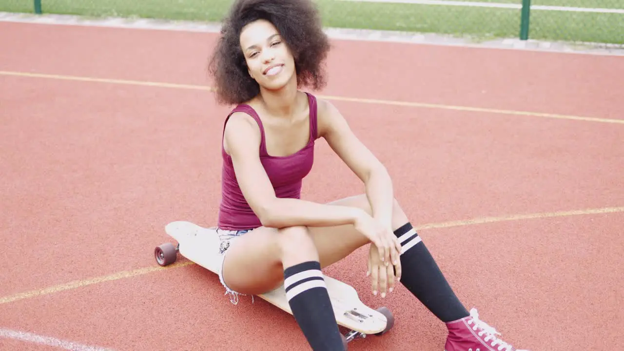 Confident sporty girl on skateboard