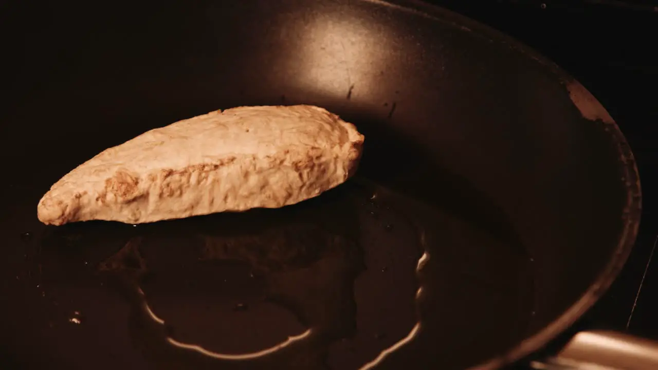 Chef Putting Frozen Vegan PlantBased Chicken Fillets in Hot Frying Pan