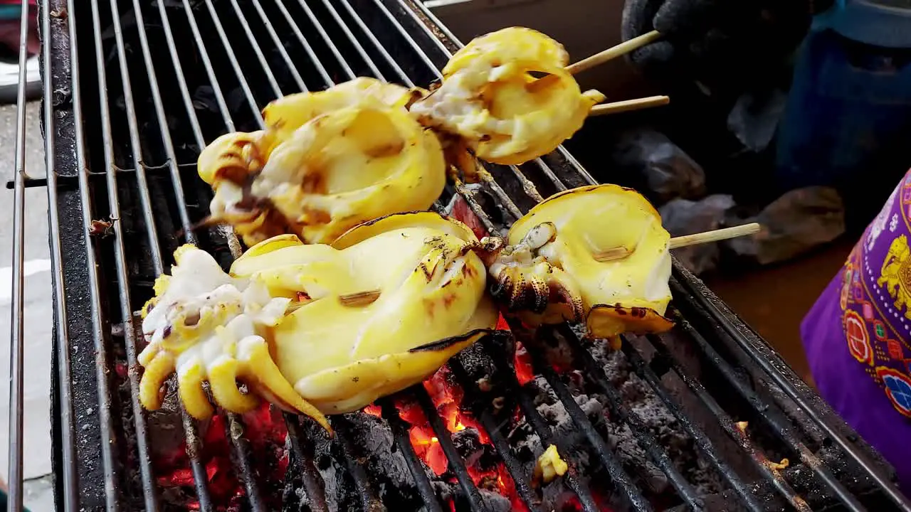 Fresh grilled squid on a coal stove seafood grilled Thai street food