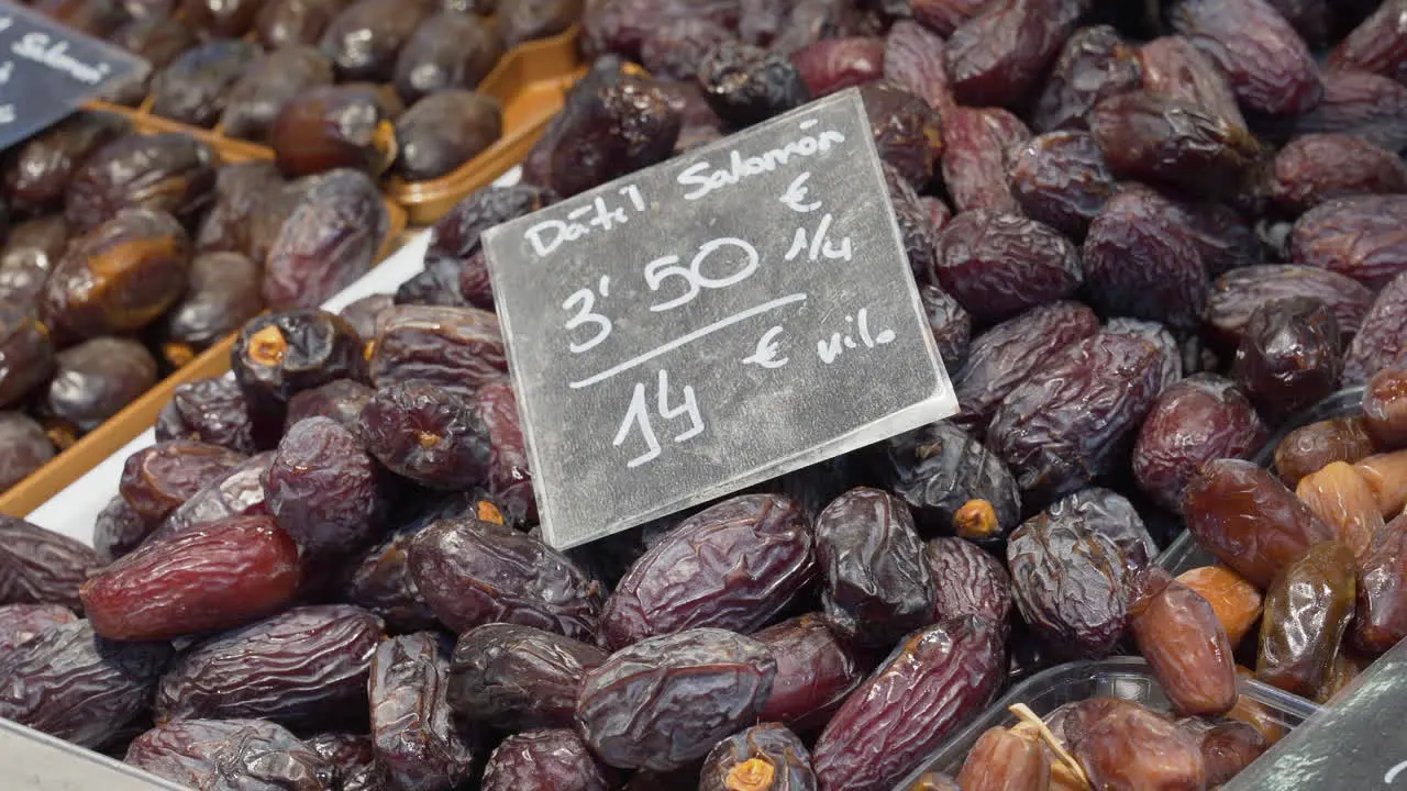 Dates piled up on a counter in the Central Market of Valencia Spain