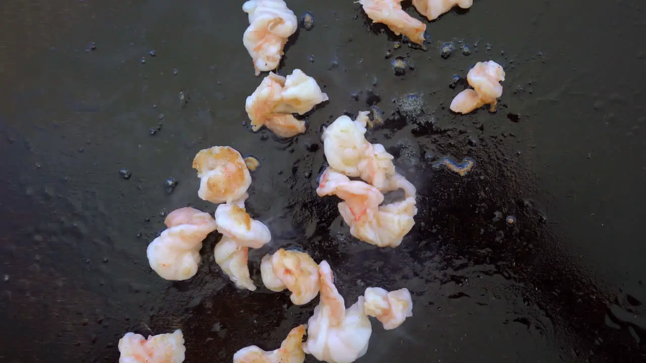 Cooking shrimp on the grill top view