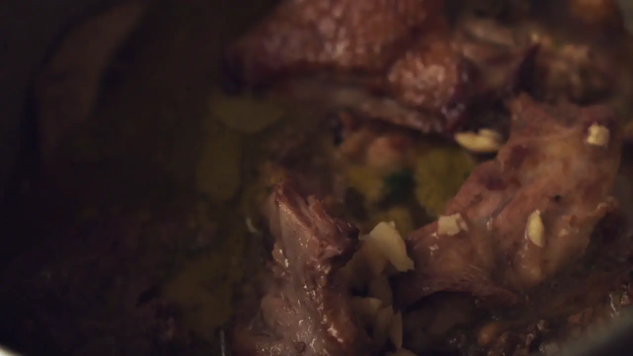 Close-up of duck prey inside a pot to be cooked