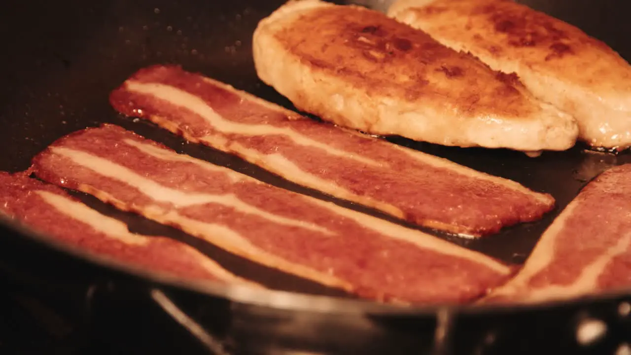 Vegan Bacon Cooking in Pan with Golden Brown PlantBased Chicken Fillets