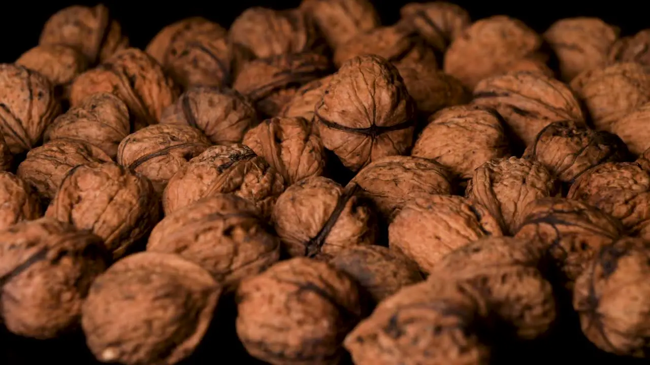 Organic Vegan-Approved Walnuts Falling into Pile Close-Up Slow Motion