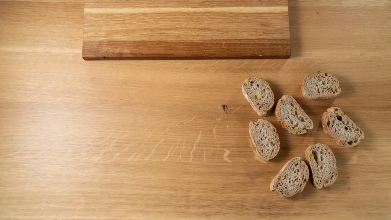 Funny topdown animation story of preparing small sandwiches for the party on the wooden table