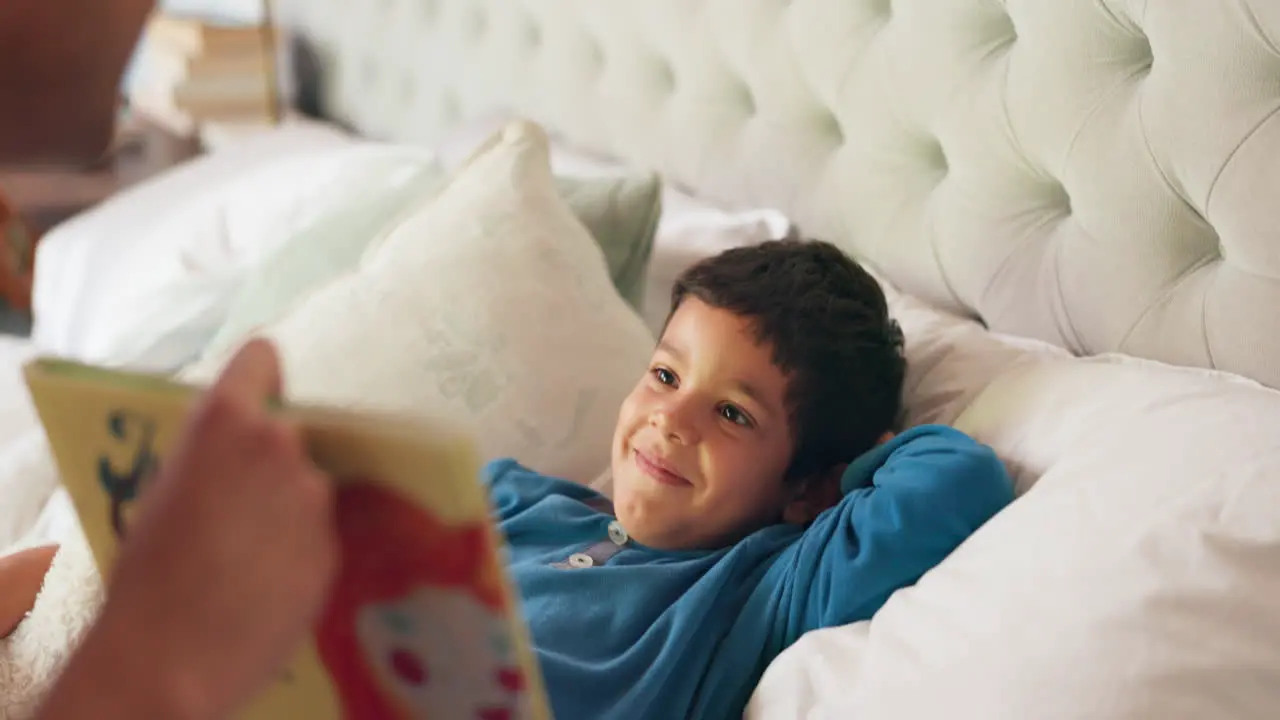 Father son and bed with book