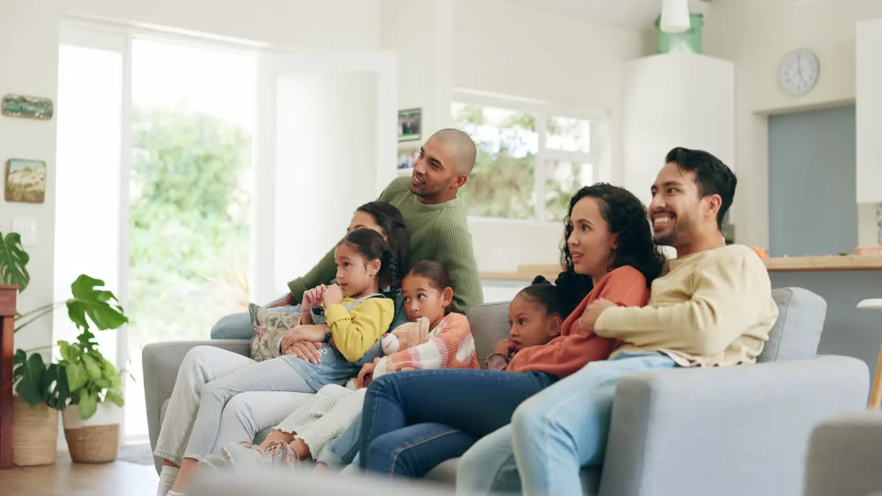 Big family watching tv and together on couch