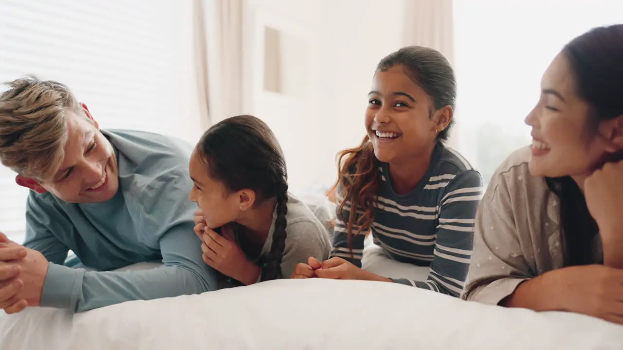 Jump bed and happy family playing in a bedroom