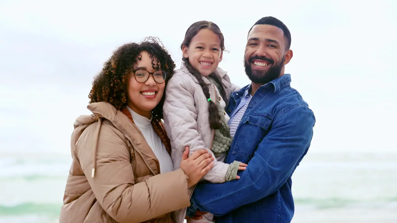 Happy family on beach portrait with parents