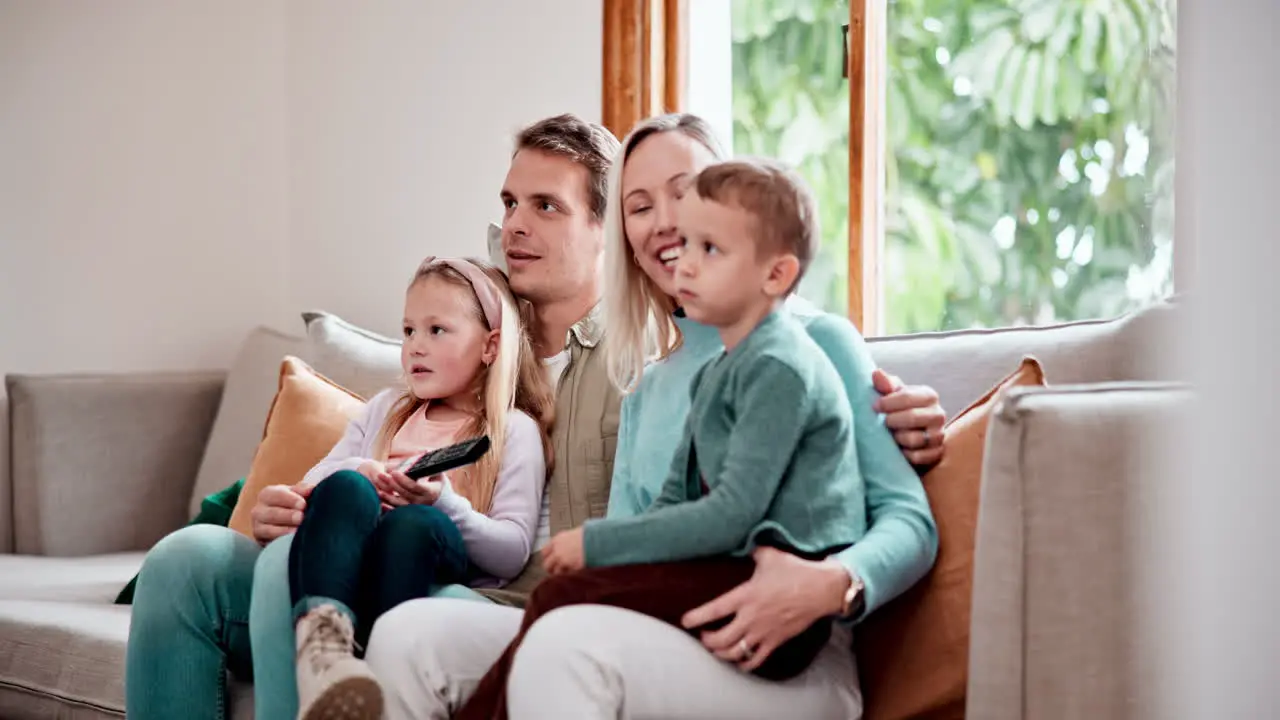 Happy family relax and watching tv on sofa