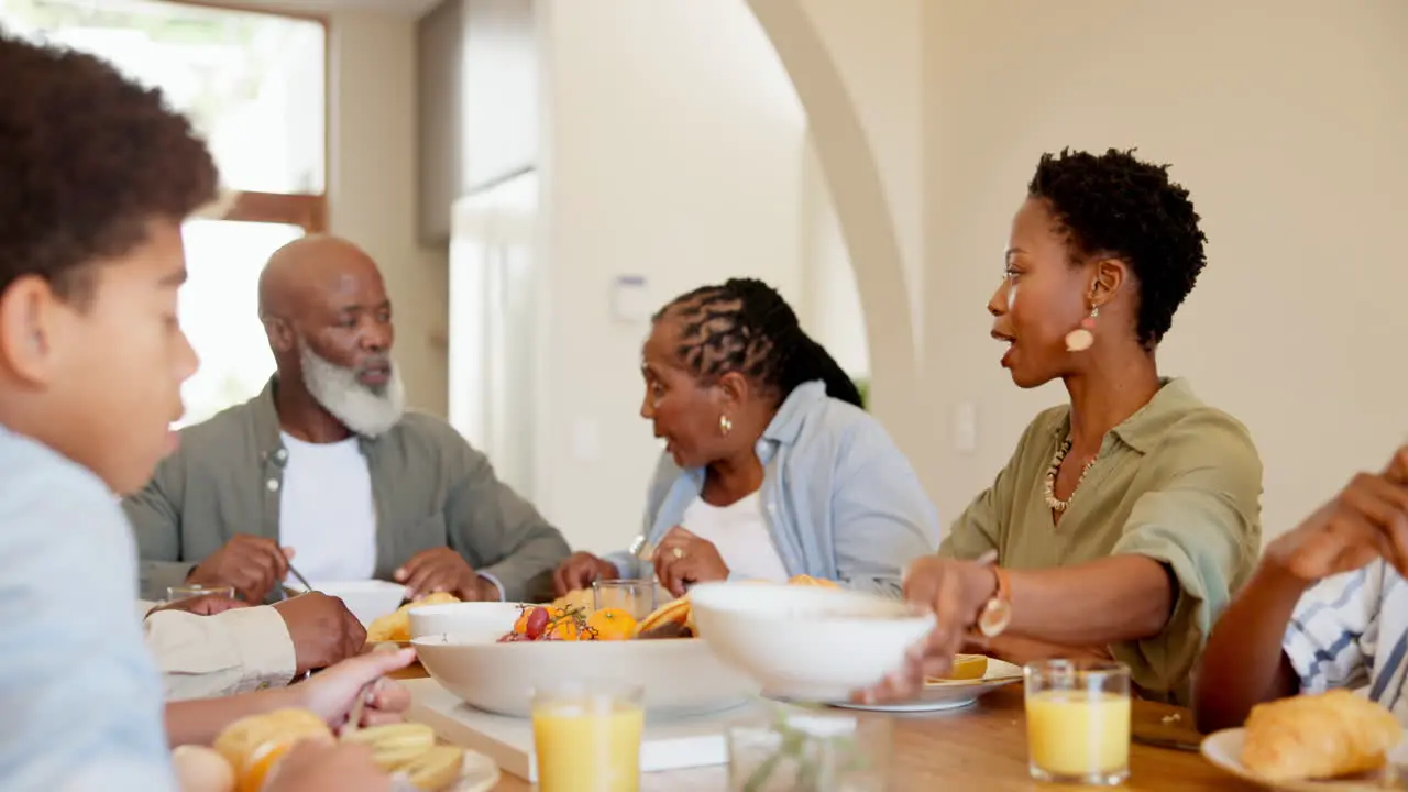 Happy black family and kids in home for lunch