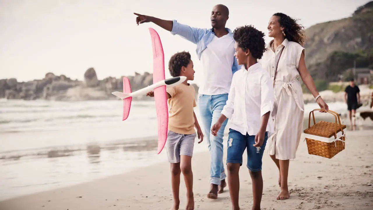 Walking happy family on beach together for picnic