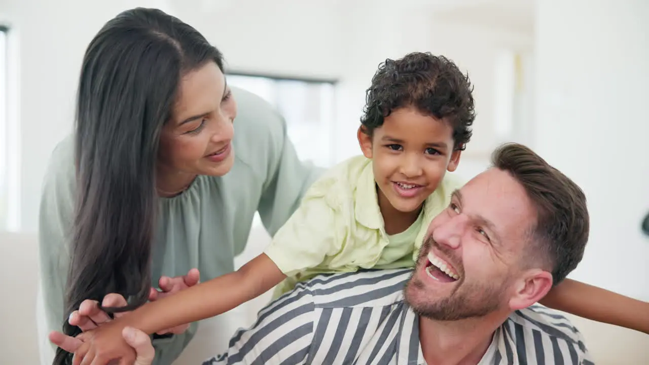 Happy playful and young parents with kid