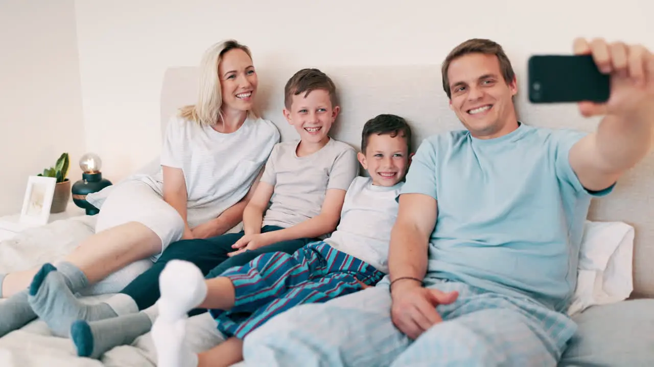 Happy family selfie and smile in bedroom