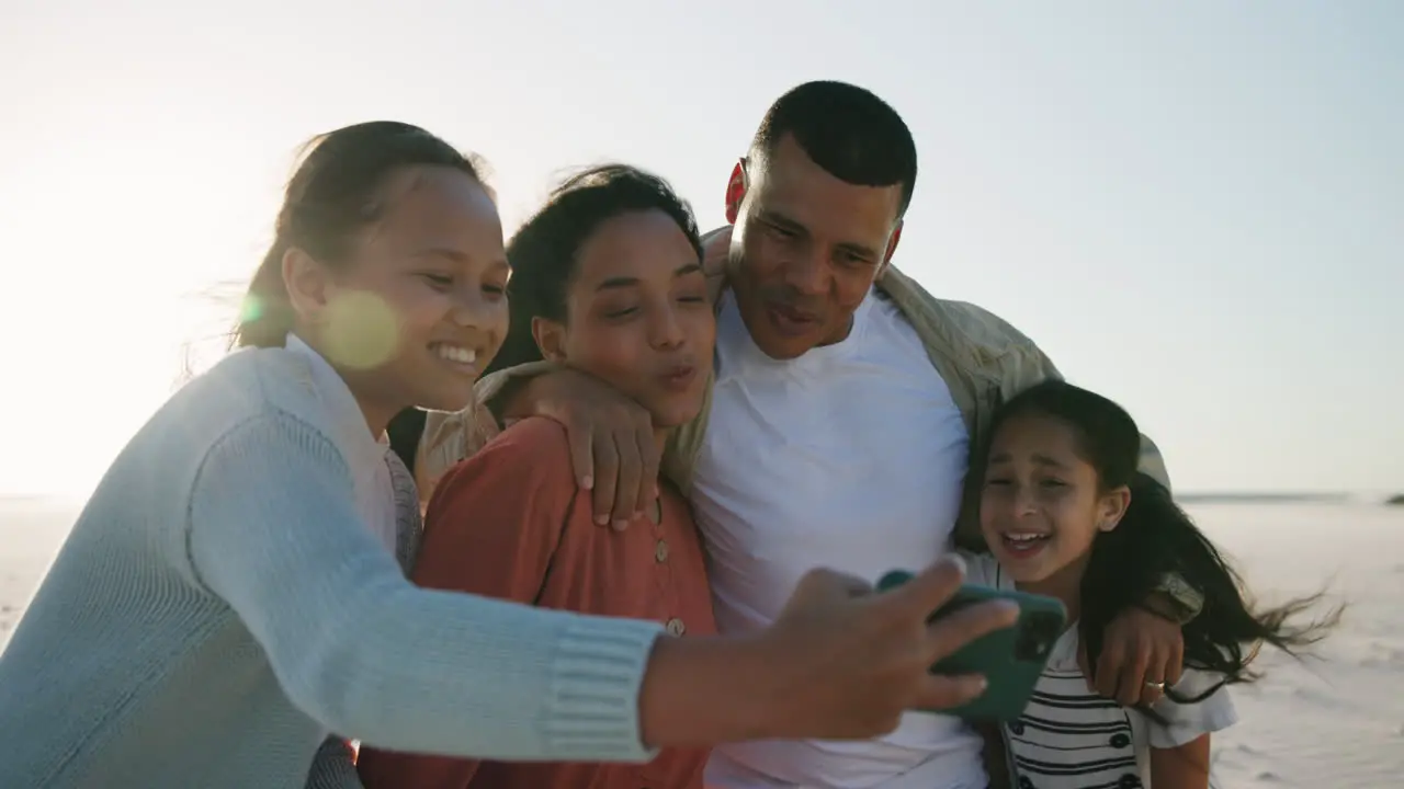 Girl children parents and beach selfie