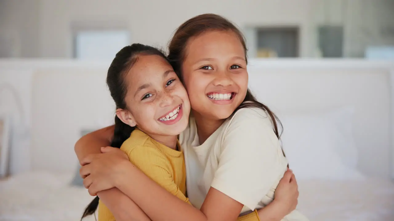 Hug sister and face of girl children on a bed