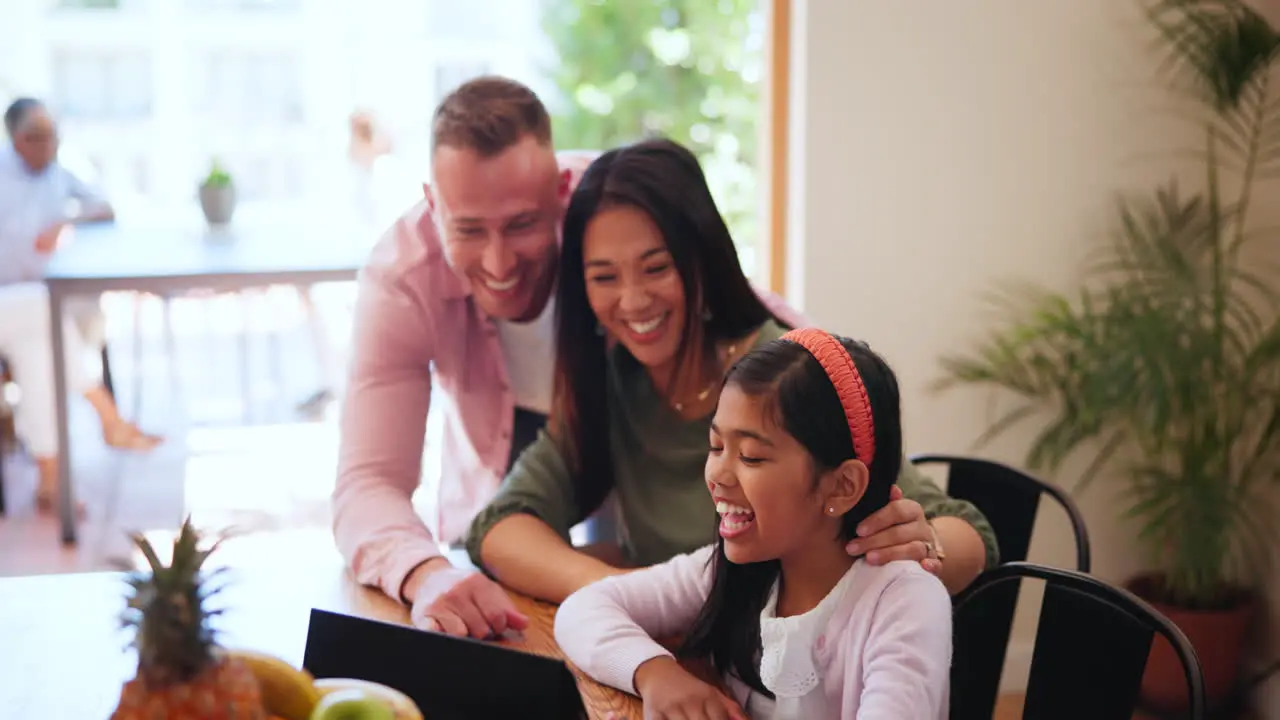 Happy family parents and child at table