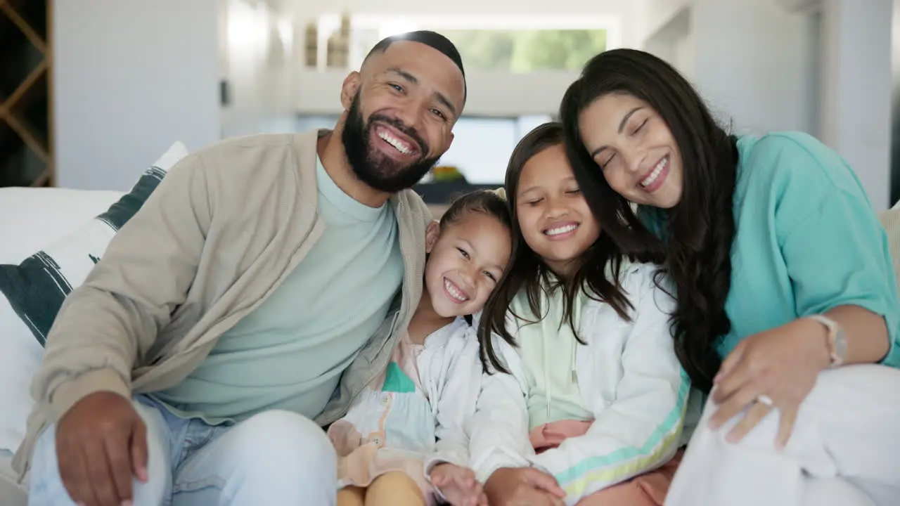 Love face and happy family on a sofa with hug