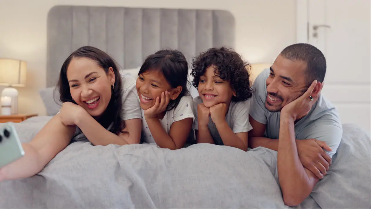 Selfie love and happy family in a bed relax