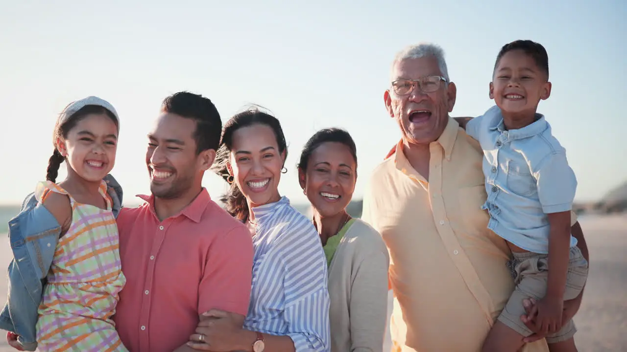 Big family smile and face on beach