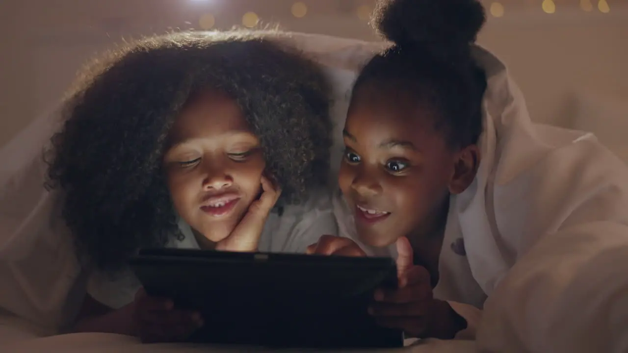 Sisters girl and tablet in bedroom