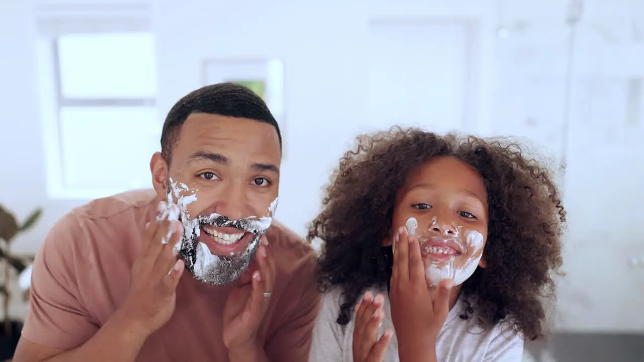 Father son and shaving cream in bathroom