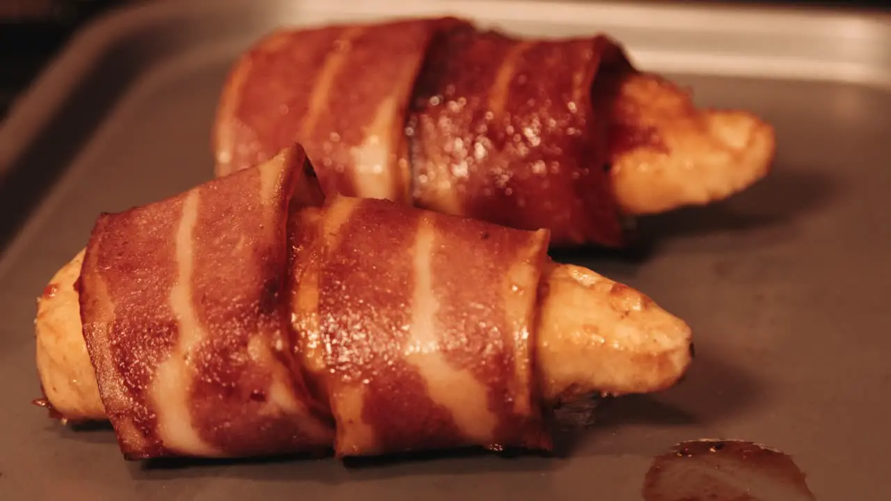 Cooked PlantBased Chicken Fillet Wrapped in Vegan Bacon on Baking Tray