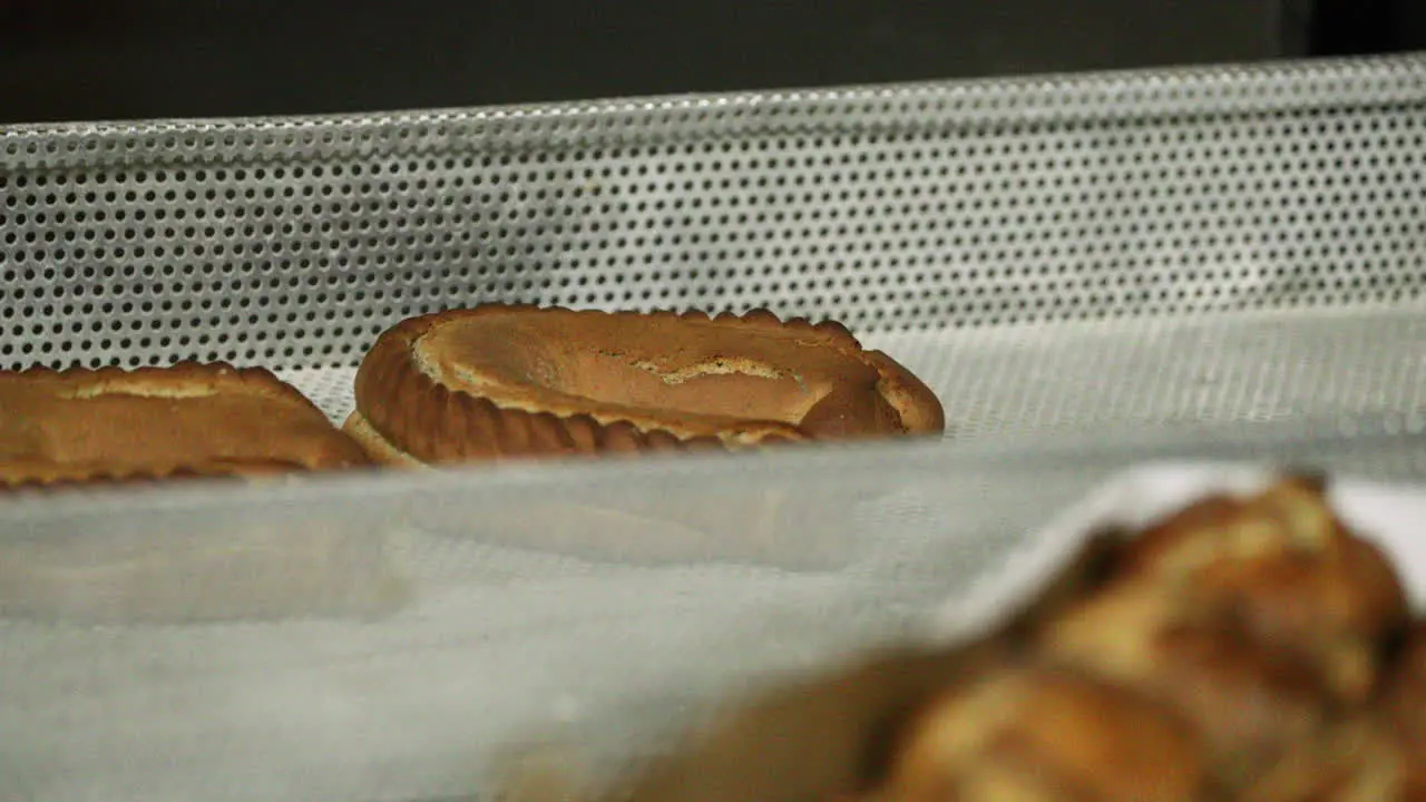 Freshly Baked Bread In An Aluminum Rack At The Bakery close up