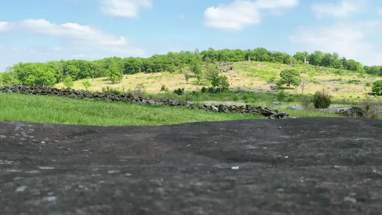 Tilt up view of Little Round Top site of American Civil War battle in Gettysburg rock wall