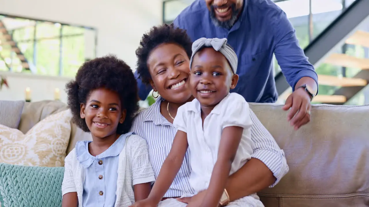 Happy family home and hug on couch