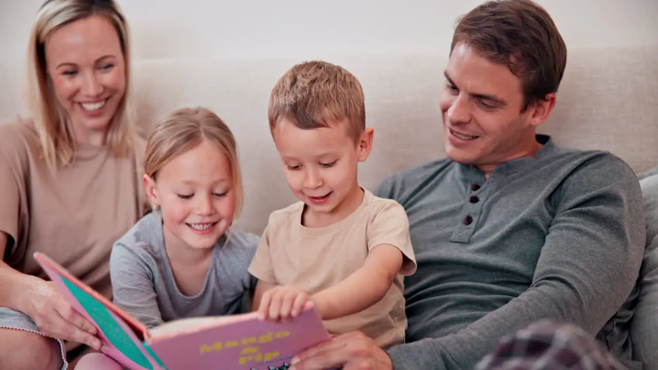 Parents children and reading books in bedroom