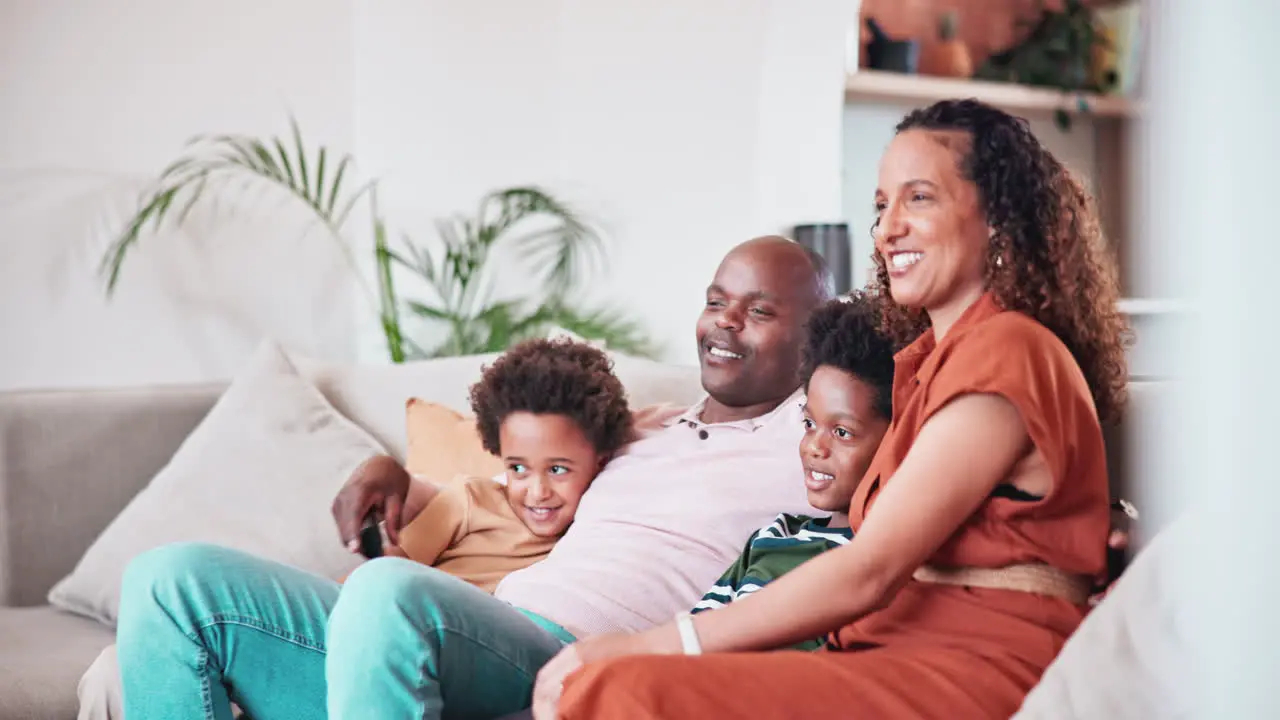 Happy relax and African family watch television