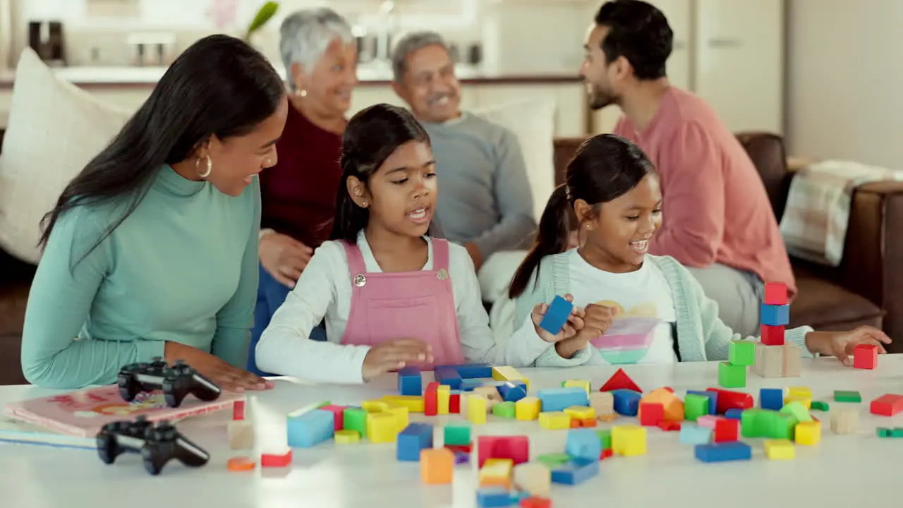 Girl kids table and building blocks with mother