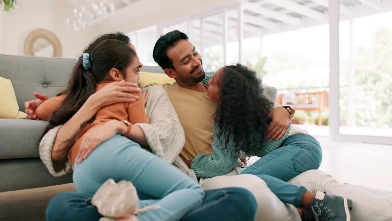 Happy family parents and children hug at home