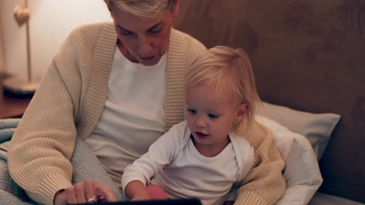 Child learning and woman with baby