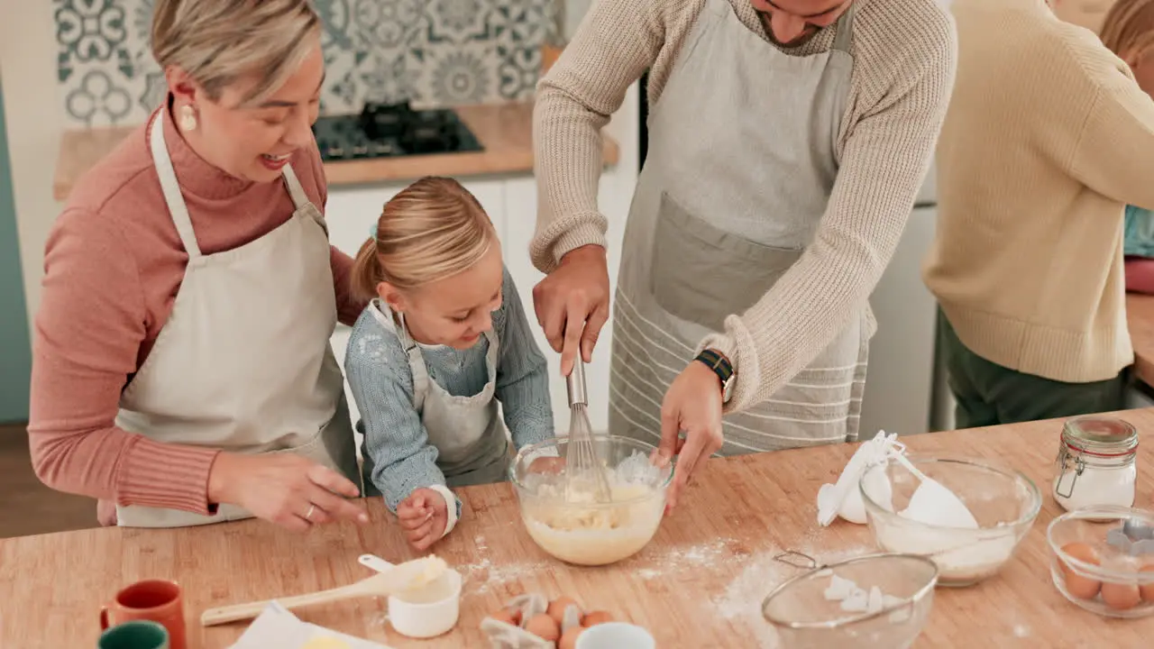 Happy family teaching or kid baking with parents