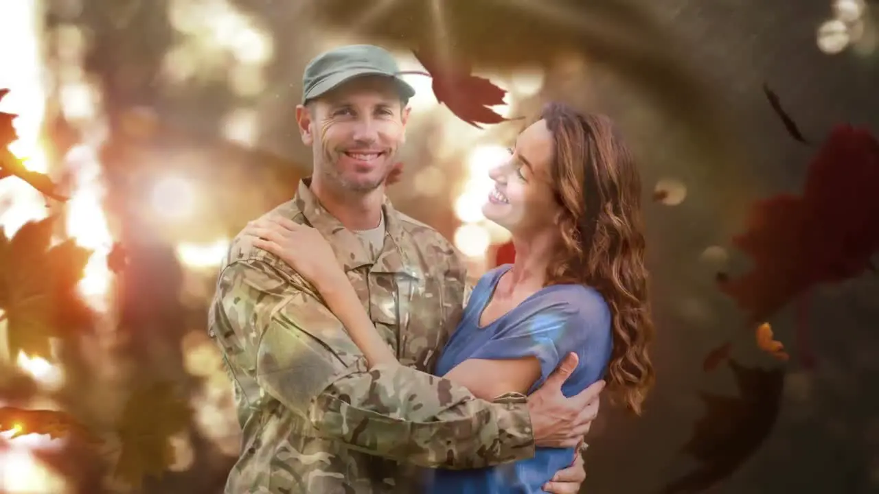 Military soldier embracing his wife against autumn leaves 4k