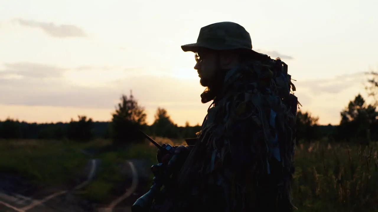 A solider aims his rifle 6