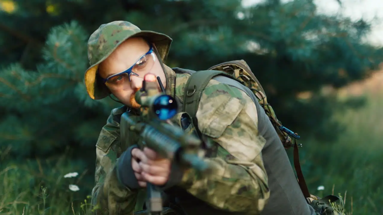 A solider aims his rifle 3