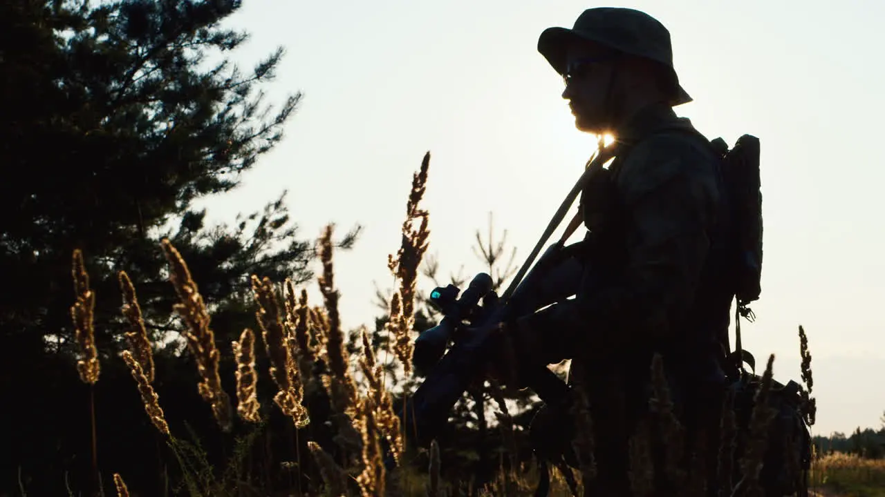 A solider aims his rifle 1