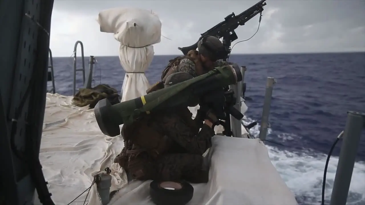 Us Marines And Navy Sailors Prepare A Javelin Shoulder Fired Anti-Tank Missile From A Mark Vi Patrol Boat In The Phillipines Sea