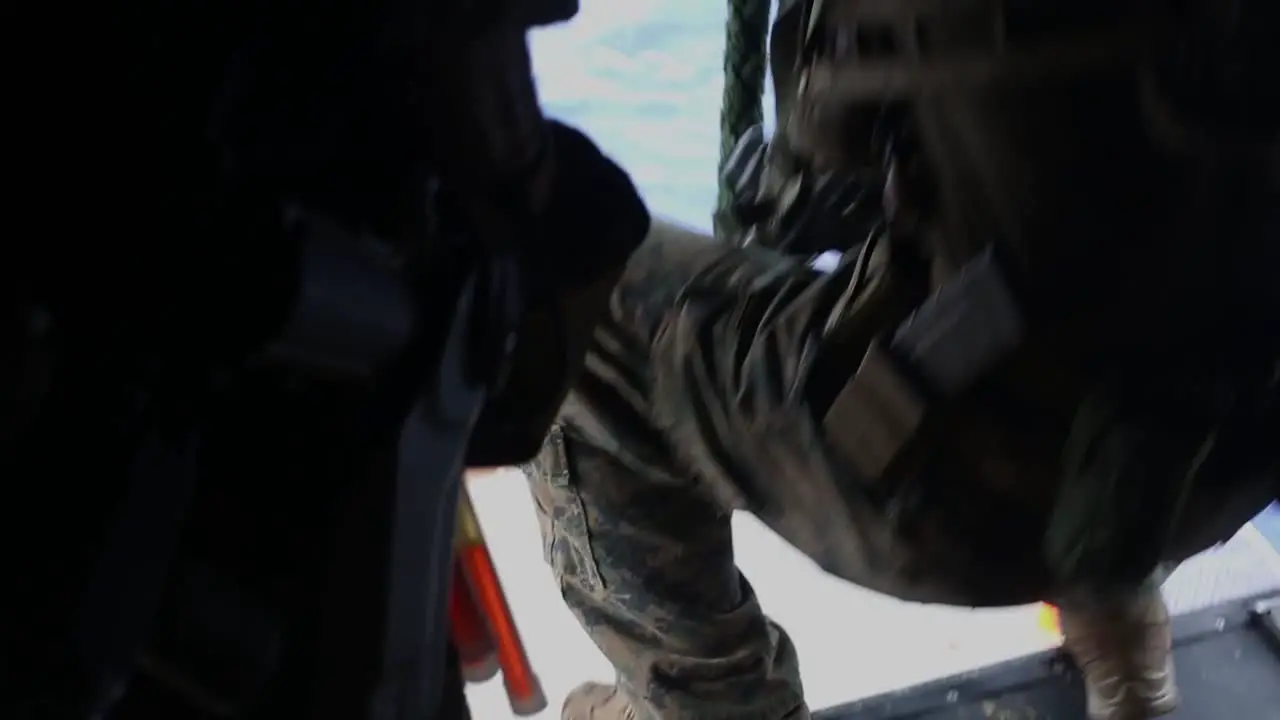 Us Marines Conduct A Fast Rope Live Fire Deck Shoot On The Uss America With M4 Carbines