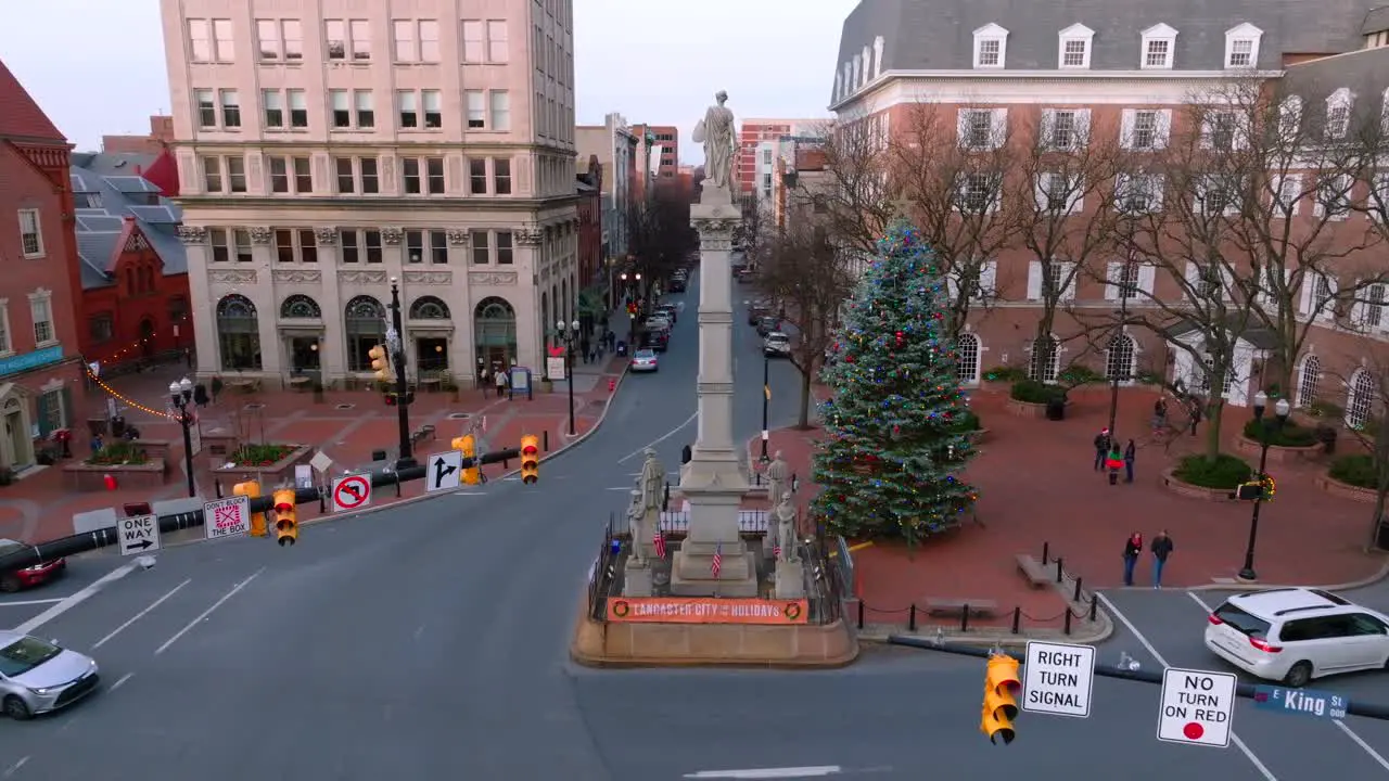 Aerial approach towards sculpture and Christmas display in downtown Lancaster PA