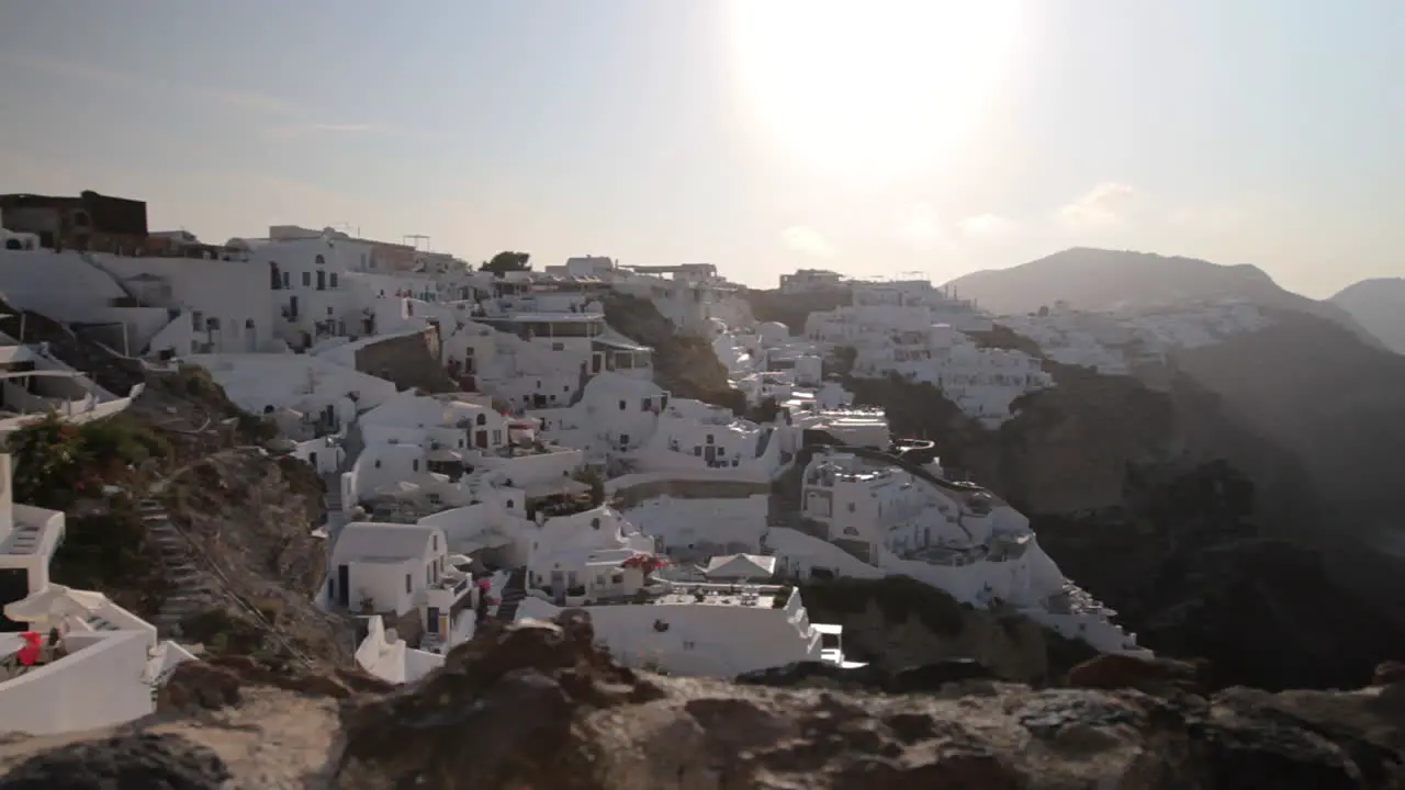 View of traditional cycladic architecture built holiday villas in Oia Santorini